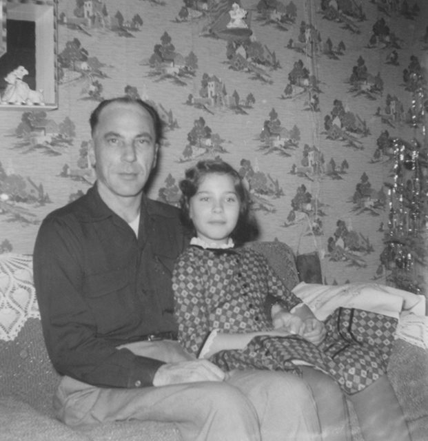 Cheri Teal as a child, sitting with her father.