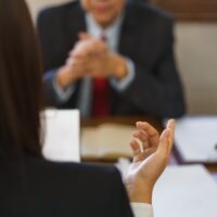A female advisor meets with a male client to discuss end of year giving.