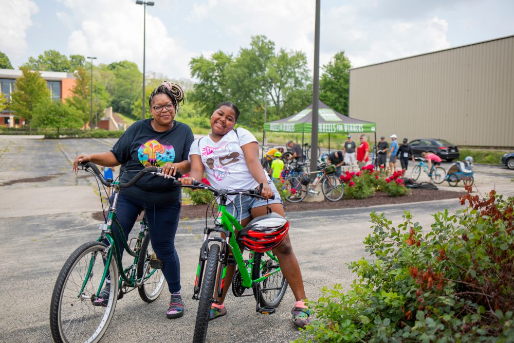 Mom and daughter pose with their new bikes