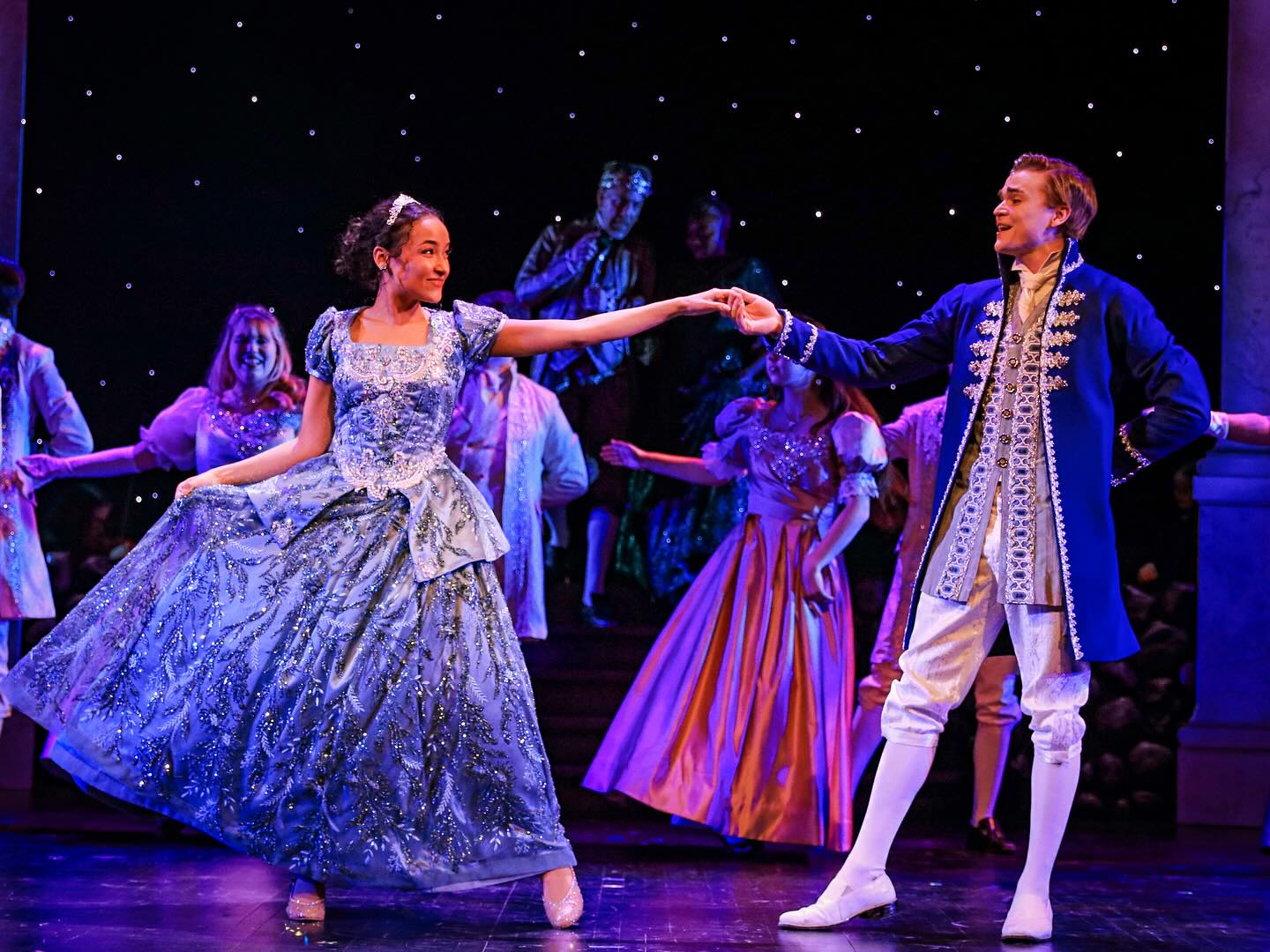 two kids play Cinderella and Prince Charming in the musical Cinderella