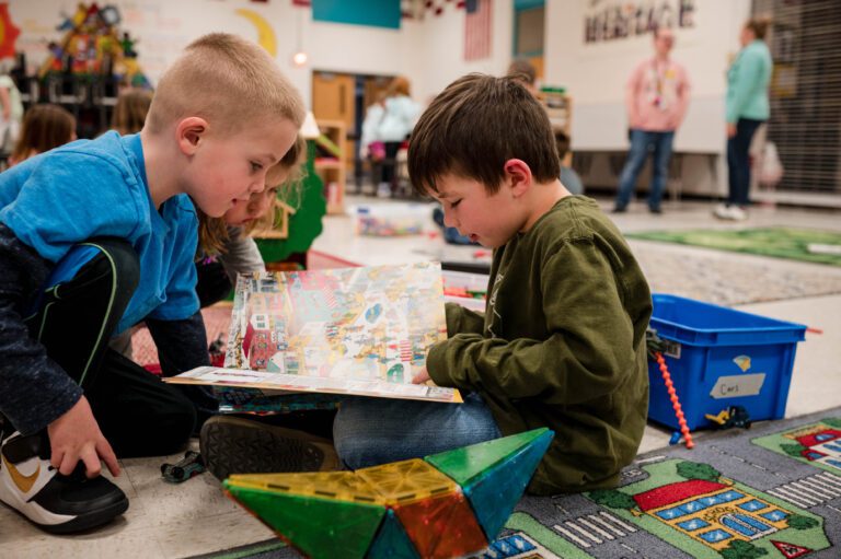 Children read a book together