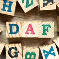 Child's colorful block letters that spell out DAF