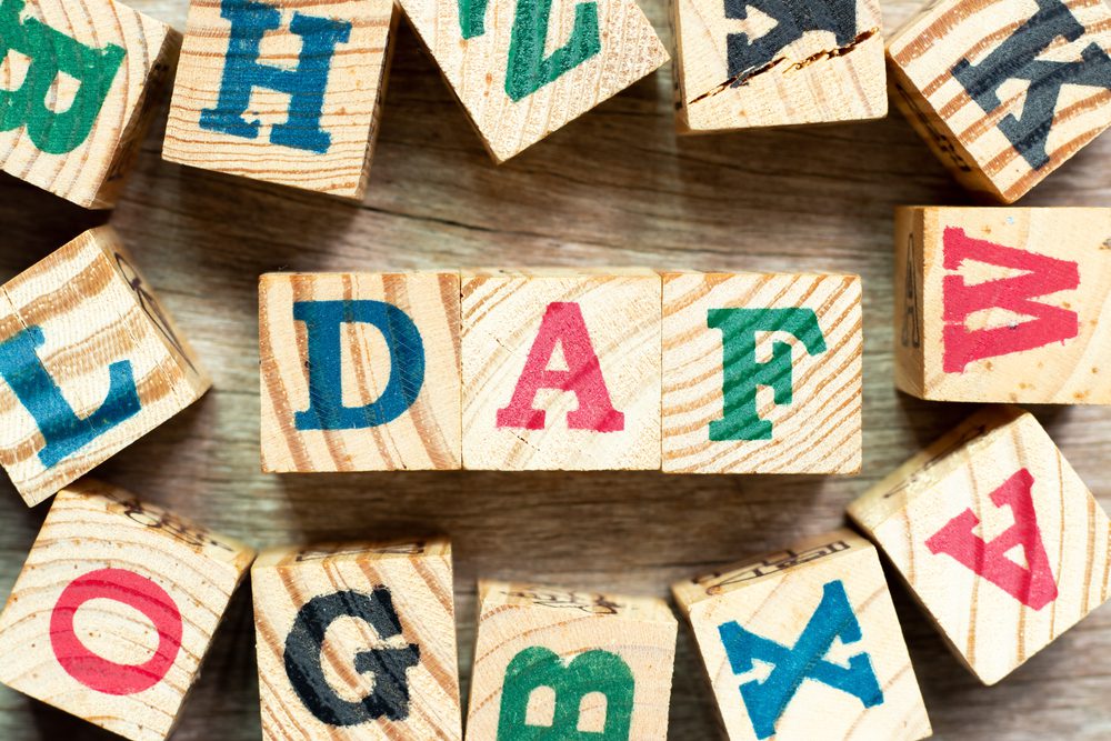 Child's colorful block letters that spell out DAF