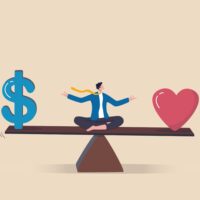 Man sitting on scale balancing between money and love
