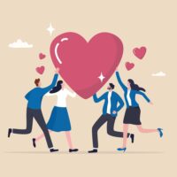 Team of people reach towards a cartoon heart