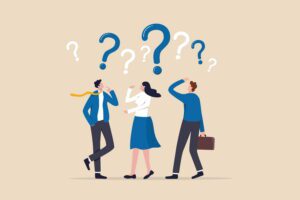 Three people in business clothes with question marks over their heads